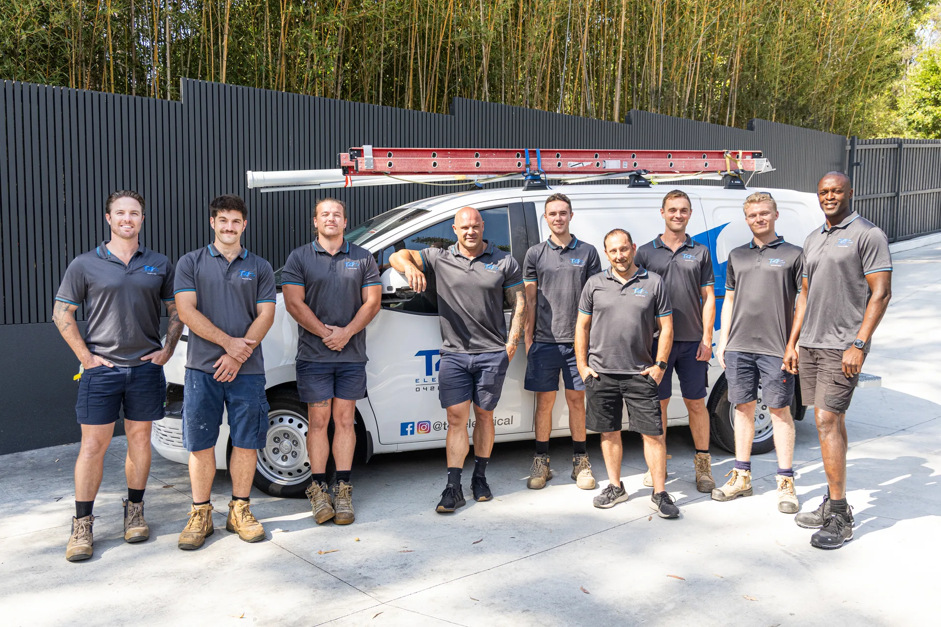 The Family Electrician Surfers Paradise team with a service van